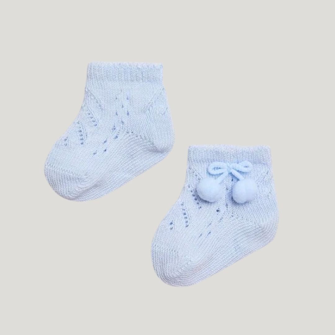 Calzini azzurri con pon - pon - Piccino store