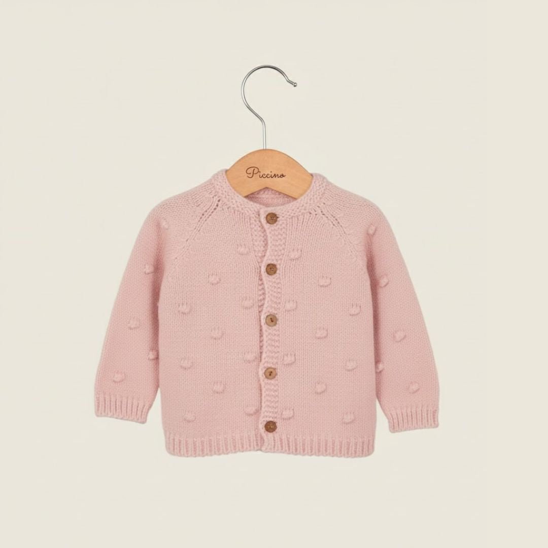 Cardigan rosa baby con pon pon - Piccino store