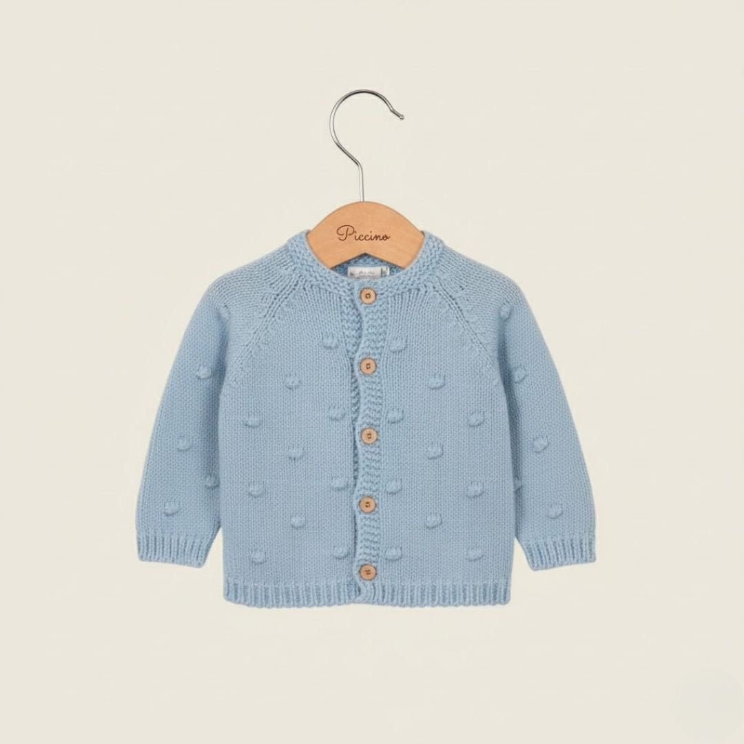 Cardigan azzurro con pon pon - Piccino store